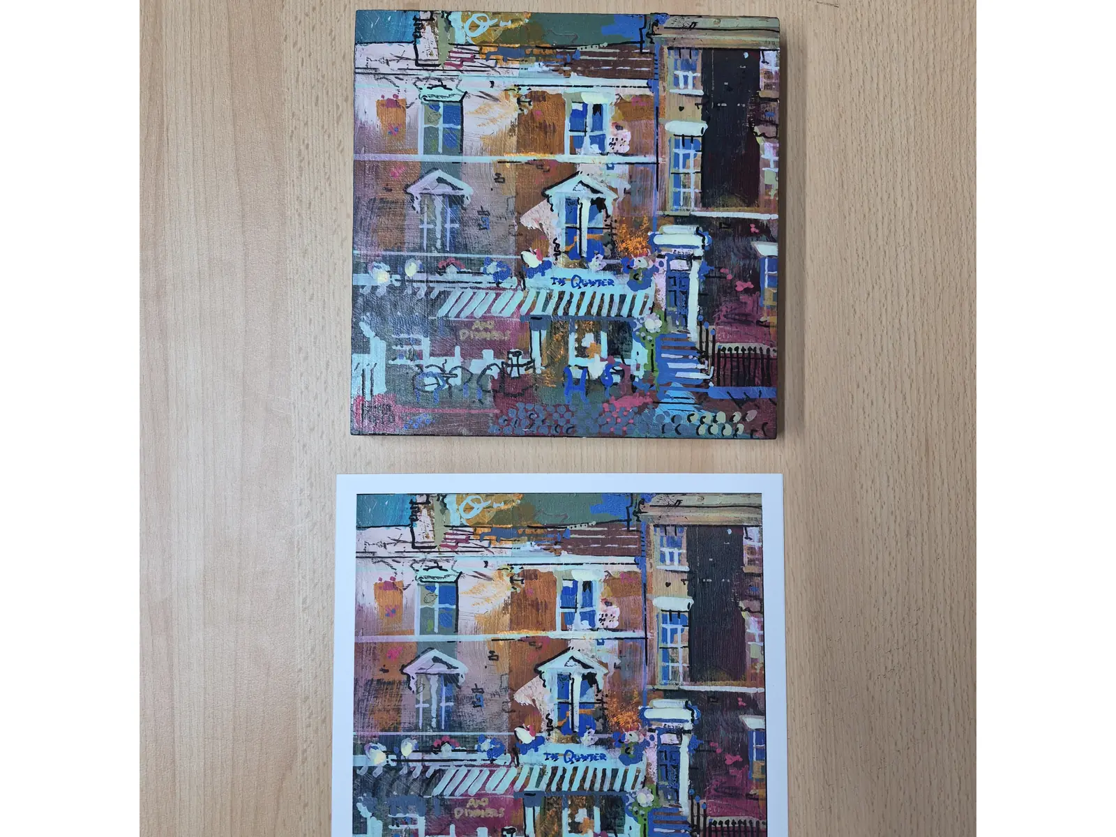 A townhouse painting and its giclée print side by side, colour matched